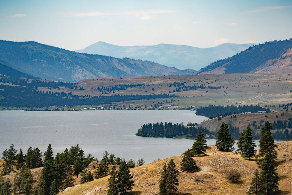 A lake below rolling hills