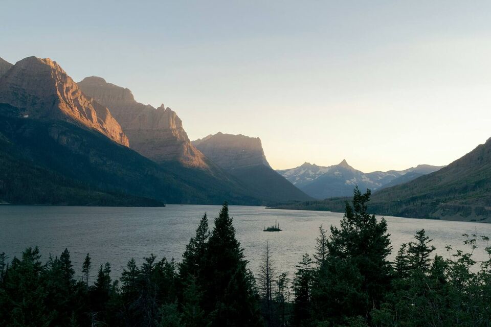 A long lake between mountains under evening light